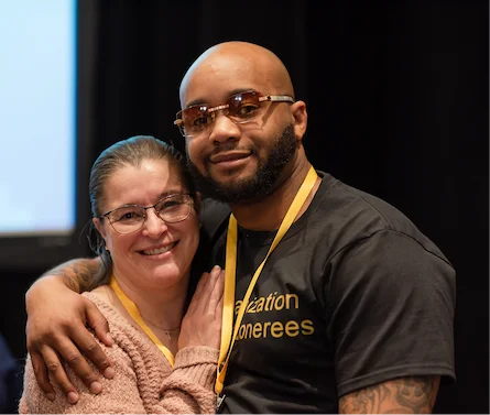 Two people posing at the Innocence Network Conference in Seattle, WA
