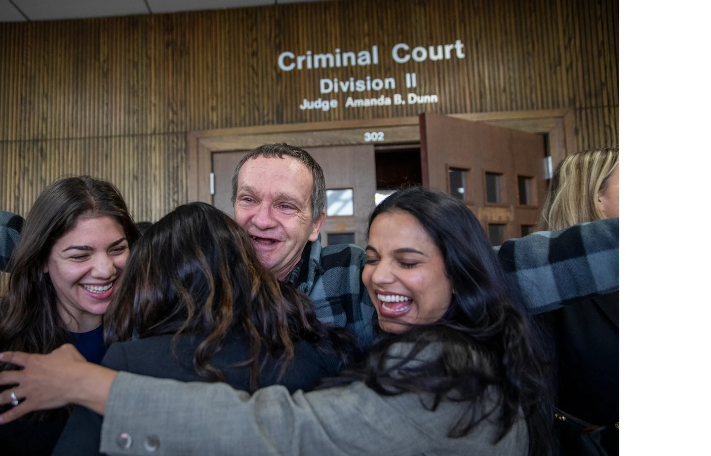 Scott Minton hugging outside criminal court